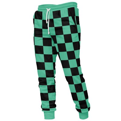 Tanjiro Kamado Demon Slayer Sweatpants feature a green and black checkered pattern, elastic waistband with white drawstring, and fitted ankle cuffs. The bold geometric design covers the entire garment.