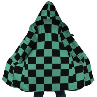 A person wearing the Tanjiro Kamado Demon Slayer Dream Cloak Coat, featuring a green and black checkered pattern inspired by the anime Demon Slayer, spreads it open to reveal the full design.