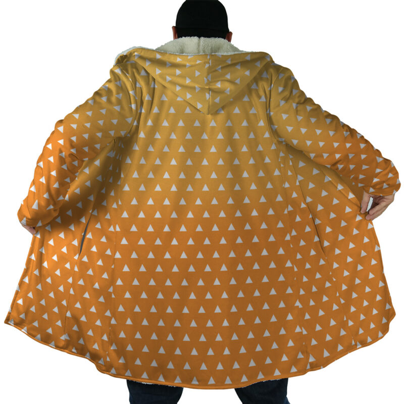 A person wearing the Zenitsu Agatsuma Demon Slayer Dream Cloak Coat, featuring a hood and white triangle pattern, spreads the cloak wide to display its interior, seen from the back.