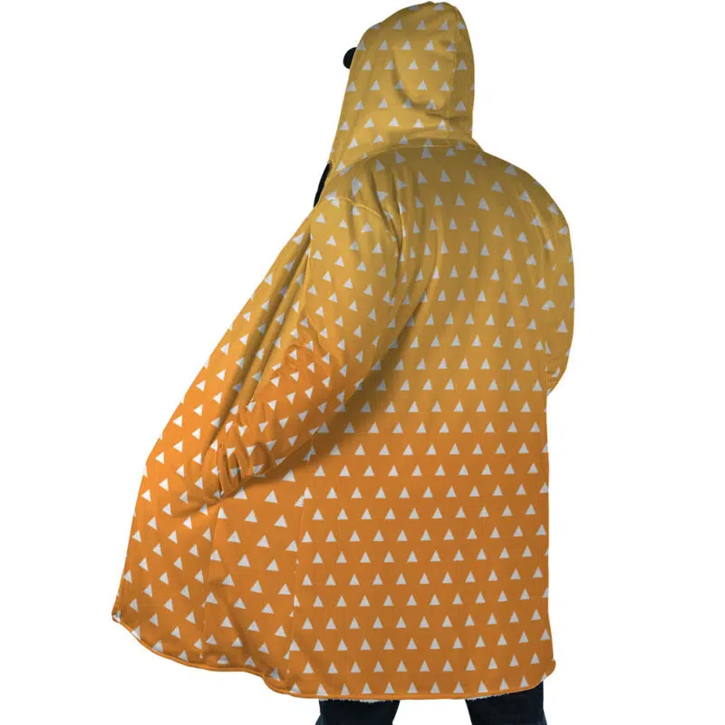 A person stands with their back to the camera, wearing the Zenitsu Agatsuma Demon Slayer Dream Cloak Coat—a hooded coat featuring an orange and yellow gradient with a small white triangle pattern.