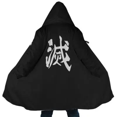A person wearing the Demon Slayer Corps. Demon Slayer Dream Cloak Coat, a long black hooded coat with wide sleeves and large white Japanese kanji characters printed on the back, stands with their arms outstretched.