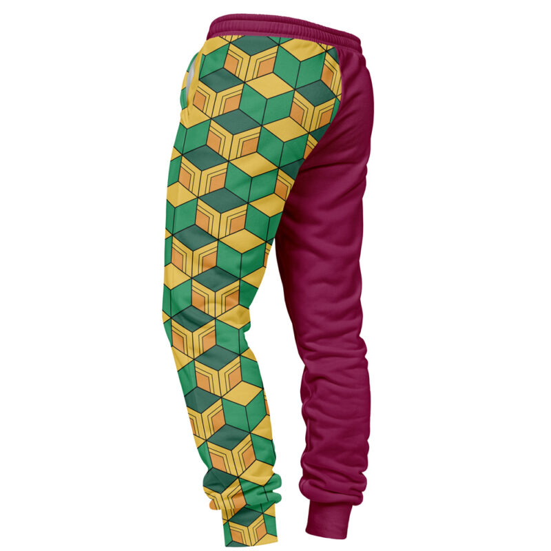 The Giyu Tomioka Demon Slayer Sweatpants feature a green and yellow geometric cube pattern on the left leg, a solid maroon right leg, and include an elastic waistband and cuffs.