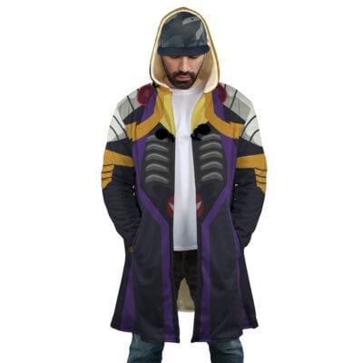 A man wears the Momonga Overlord Dream Cloak Coat, a long hooded coat with bold black, purple, gold, and gray patterns inspired by futuristic armor, standing hands-in-pockets.