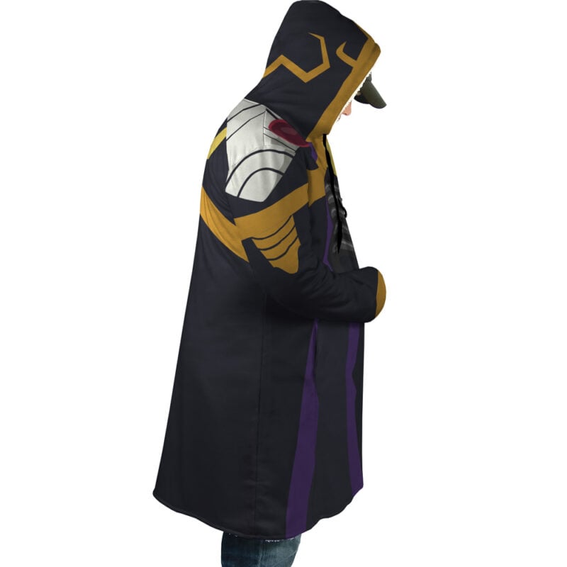 A person stands in profile with hands in pockets, wearing the Momonga Overlord Dream Cloak Coat inspired by Thanos from Marvel, featuring gold, purple, and white accents and a long hooded design.