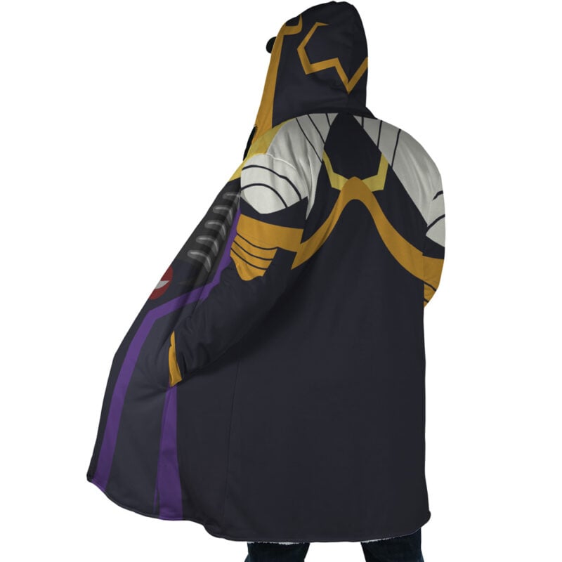 A person stands mostly with their back to the camera, wearing the Momonga Overlord Dream Cloak Coat—a hooded coat inspired by armor with a bold graphic design in black, gold, gray, and purple on the back and hood.