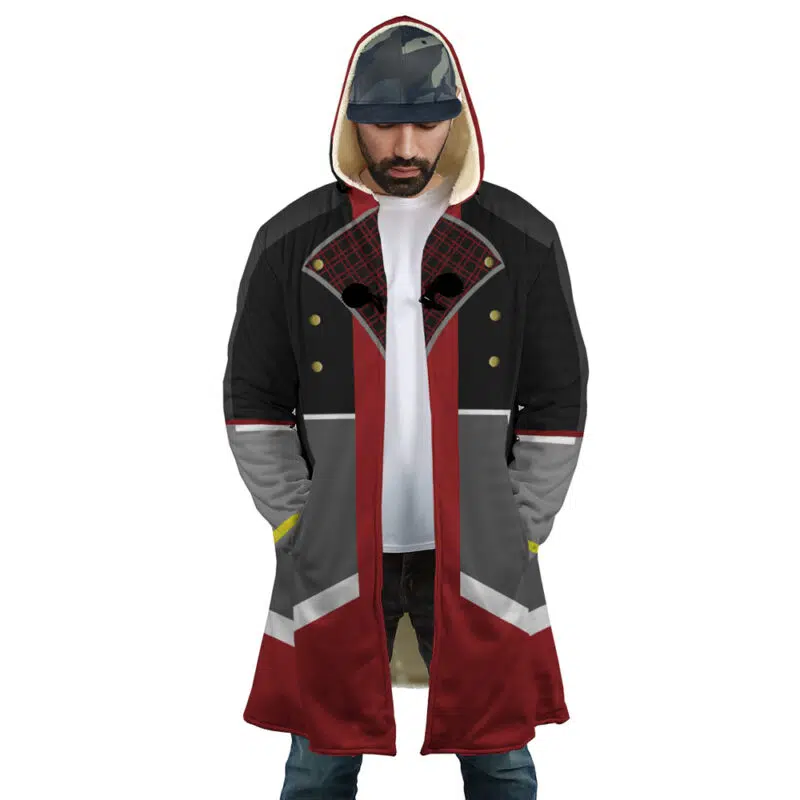 A man wearing the Sora Kingdom Hearts Dream Cloak Coat—featuring black, red, and gray panels, gold buttons, and a red plaid lining—stands with his hands in his pockets. He has a beard, a gray cap, and looks downward.