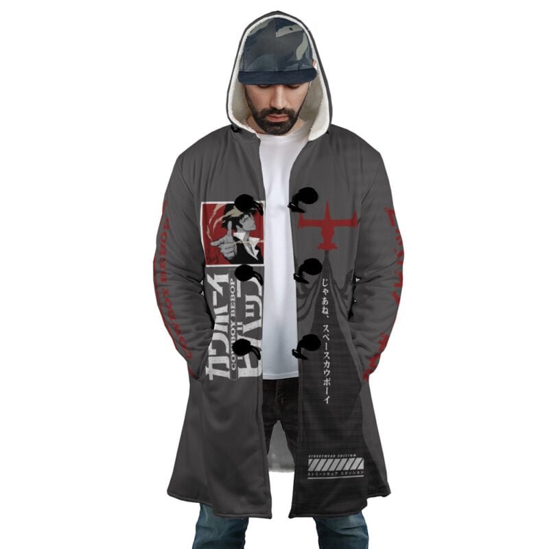 A man wears the Spiegel Spike 2 Dream Cowboy Bebop Dream Cloak Coat, a long dark gray coat with red graphics, Japanese text, black toggle buttons, a red airplane silhouette, over a gray hoodie and cap.