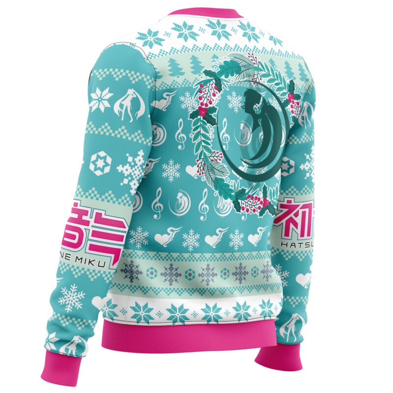 The Christmas Symphony Hatsune Miku Ugly Christmas Sweater features teal and white colors, snowflakes, music notes, leeks, a wreath design, Japanese characters, pink cuffs and waistband, and "Hatsune Miku" written on the sleeve.