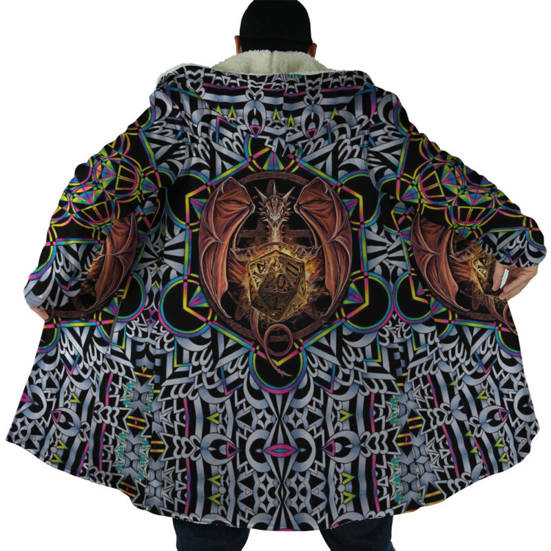 Someone wears the Trippy Dungeons & Dragons Dream Cloak Coat, featuring a bold dragon-with-shield design on the back and intricate geometric patterns in black, white, green, purple, and gold.