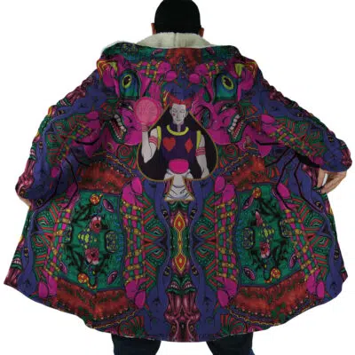 A person faces away, revealing the Trippy Mystic Faces Hisoka Hunter X Hunter Dream Cloak Coat lined with a vibrant, psychedelic design featuring Hisoka holding a staff and surrounded by bold green, purple, and red patterns.