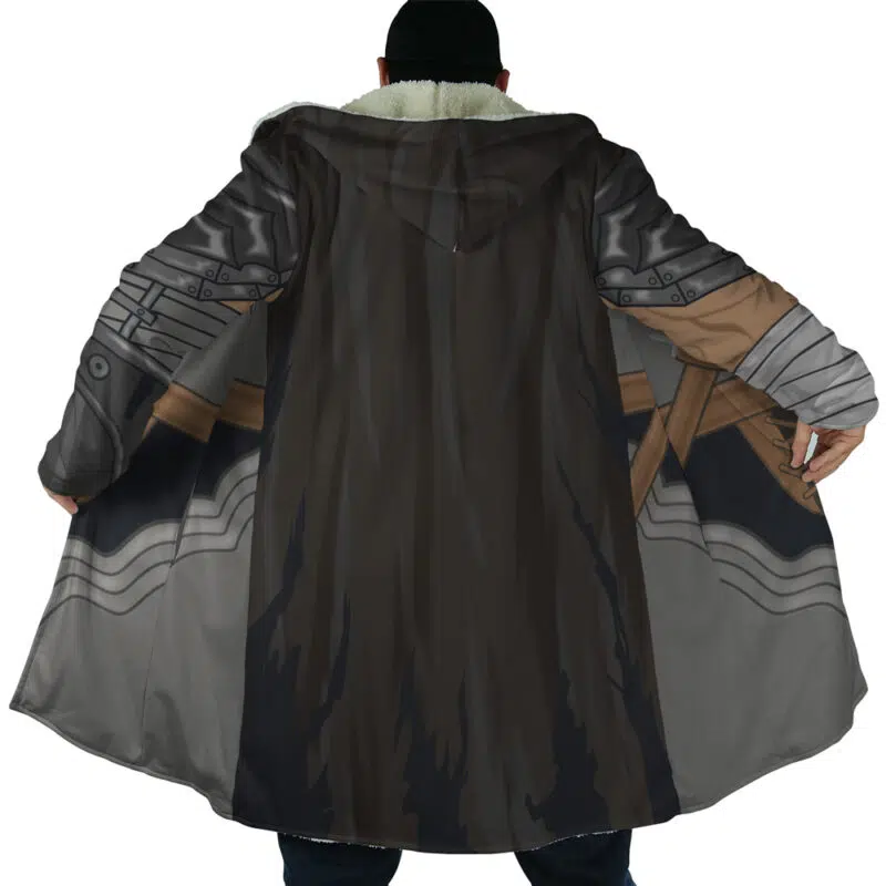 A person wearing the Guts Armor Berserk Dream Cloak Coat, featuring a printed metallic armor design with brown straps, is shown from the back with arms outstretched to display the full pattern.