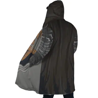 A person is seen from the back wearing the Guts Armor Berserk Dream Cloak Coat—a long, hooded coat with an armor print and a dark, fur-like cape. The hood is up, partly obscuring their head and face.
