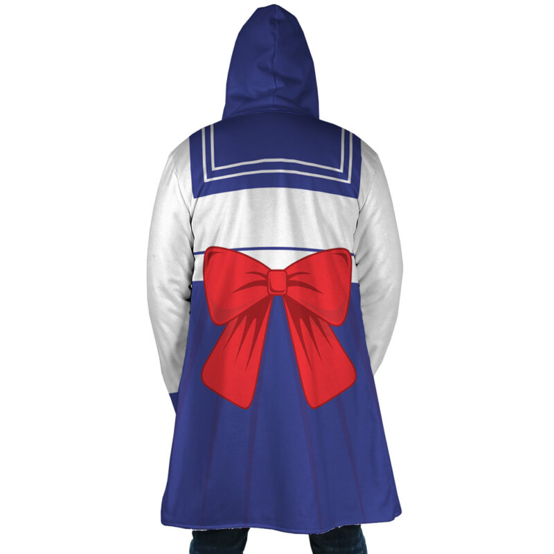 A person wearing the Sailor Guardian Sailor Moon Dream Cloak Coat, styled like a sailor uniform with a blue skirt, white top with blue stripes, and a large red bow on the back, stands facing away from the camera.