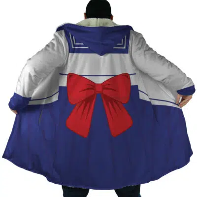 Someone wearing the Sailor Guardian Sailor Moon Dream Cloak Coat, featuring a long hooded design styled like a sailor school uniform with a large red bow on the back, blue skirt details, and white-and-blue trim, arms extended to show off the coat.