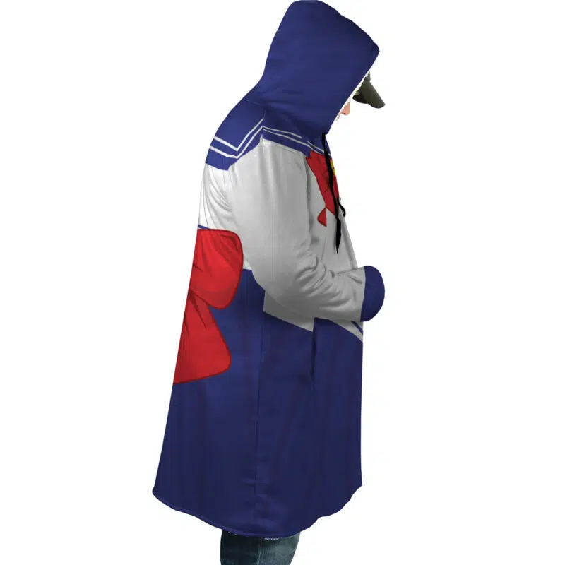 A person in profile wears the Sailor Guardian Sailor Moon Dream Cloak Coat, featuring a blue skirt, white top, red bow, and hood, with hands in pockets.