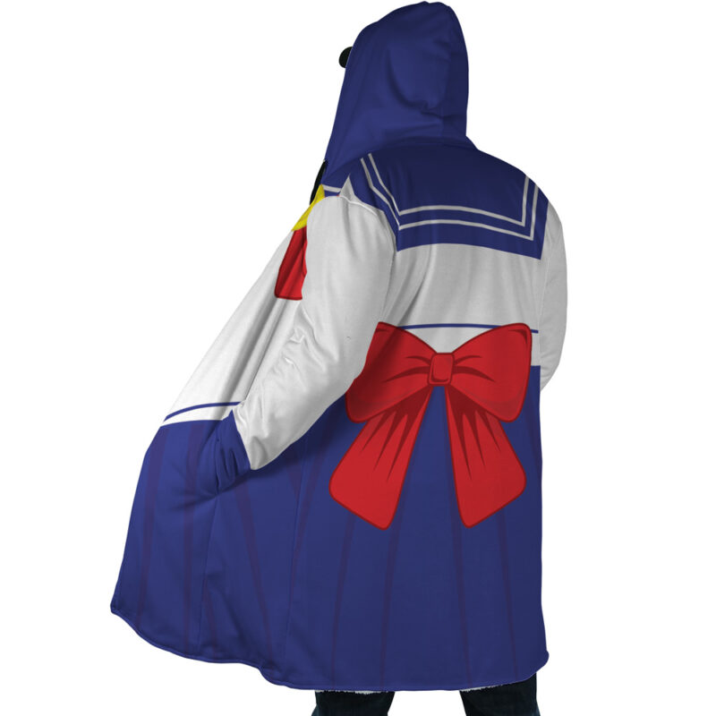 A person faces away from the camera wearing the Sailor Guardian Sailor Moon Dream Cloak Coat, designed like a Sailor Moon costume with a blue skirt-style bottom, white top, sailor collar, and large red bow on the back.