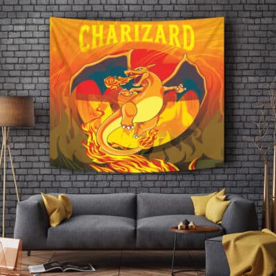 A living room with a gray couch and wooden lamp features the Trippy Charizard Pokemon Tapestry, showing Charizard breathing fire with its name in bold yellow letters against a fiery background.