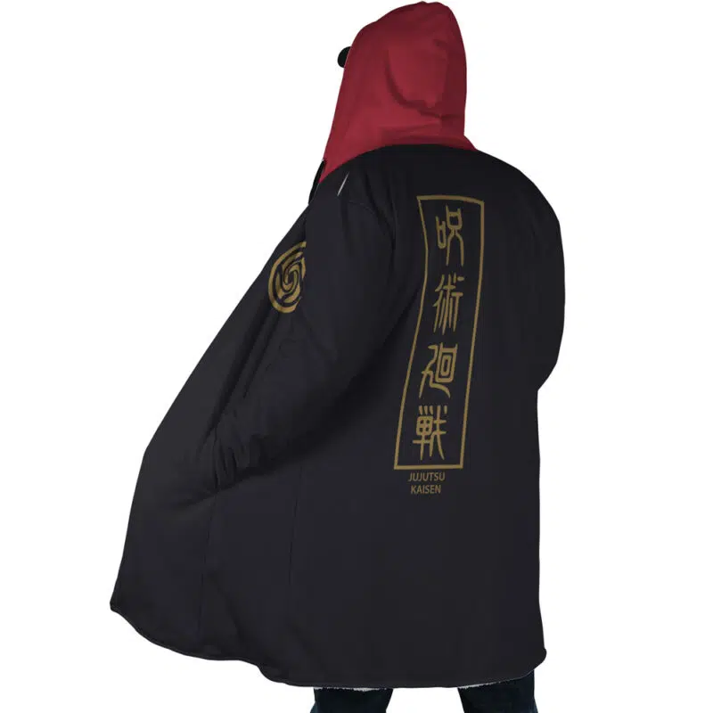 A person wearing the Yuji Itadori Jujutsu Kaisen Dream Cloak Coat with a red hood and black body. Gold Japanese characters and Jujutsu Kaisen in English are printed on the back. The person is facing away from the camera.