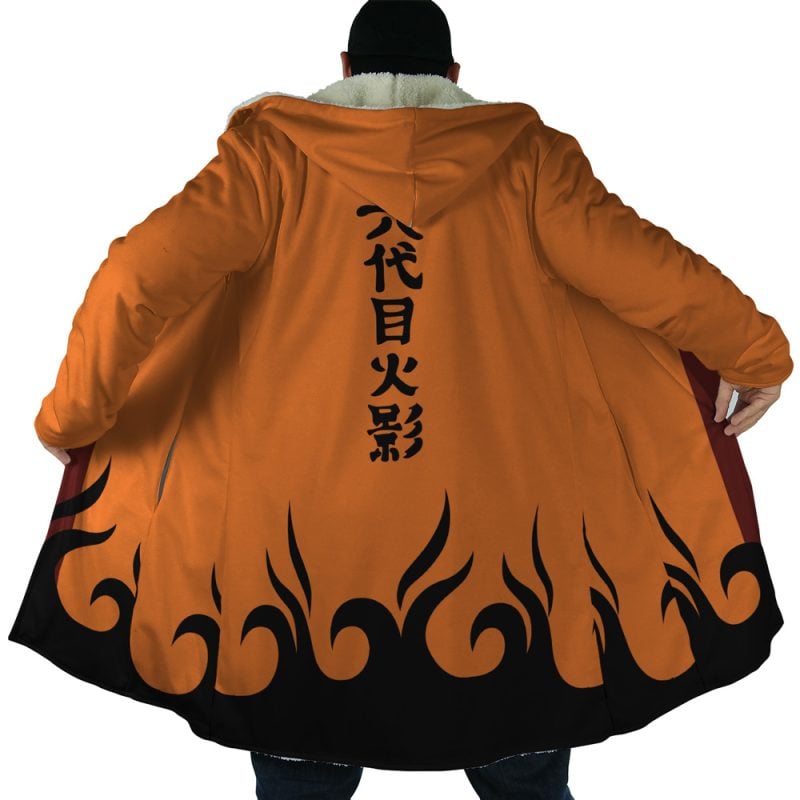 A person wearing the Hokage Orange Shippuden Dream Cloak Coat, featuring a fur collar, black flame patterns on the hem, and Japanese kanji on the back, extends their arms to display the coat’s design.