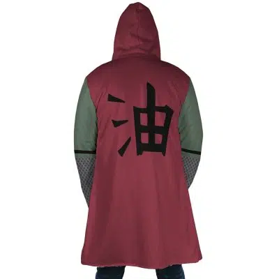 A person wearing the Jiraiya Uniform Shippuden Dream Cloak Coat, featuring a red hood, green sleeves, and a large black kanji on the back, stands with their back to the camera.