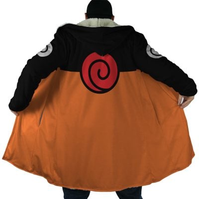 A person wearing the Uzumaki Shippuden Dream Cloak Coat faces away, showing off its black top, orange bottom, large red swirl on the back, and open cloak revealing the contrasting inside lining.