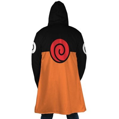 A person wears the Uzumaki Shippuden Dream Cloak Coat, featuring an orange lower half, black upper half, large red spiral on the back, and white swirls on both sleeves. The person is facing away from the camera.
