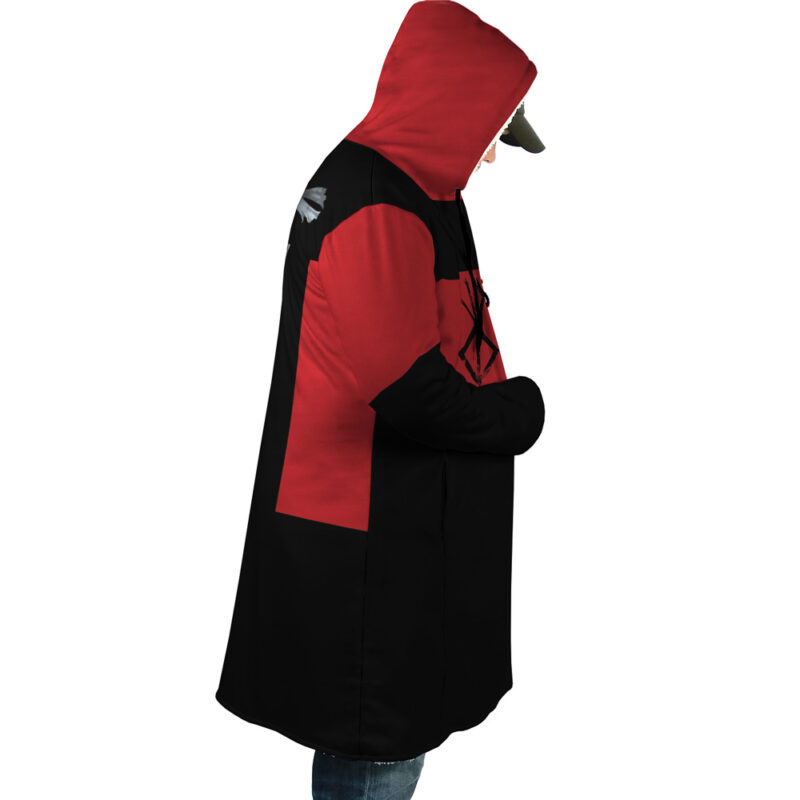 A person stands in profile facing right, wearing the Guts Dragonslayer Berserk Dream Cloak Coat over a cap, hands in pockets. The coat has a red and black design with a dragon motif. The background is white.