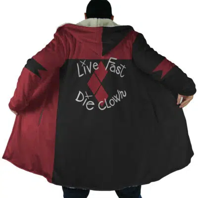 A person wearing the Harley Quinn The Suicide Squad DC Dream Cloak Coat—long, red and black with diamond patterns and "Live Fast Die Clown" on the back—stands with their back to the camera and the coat open.