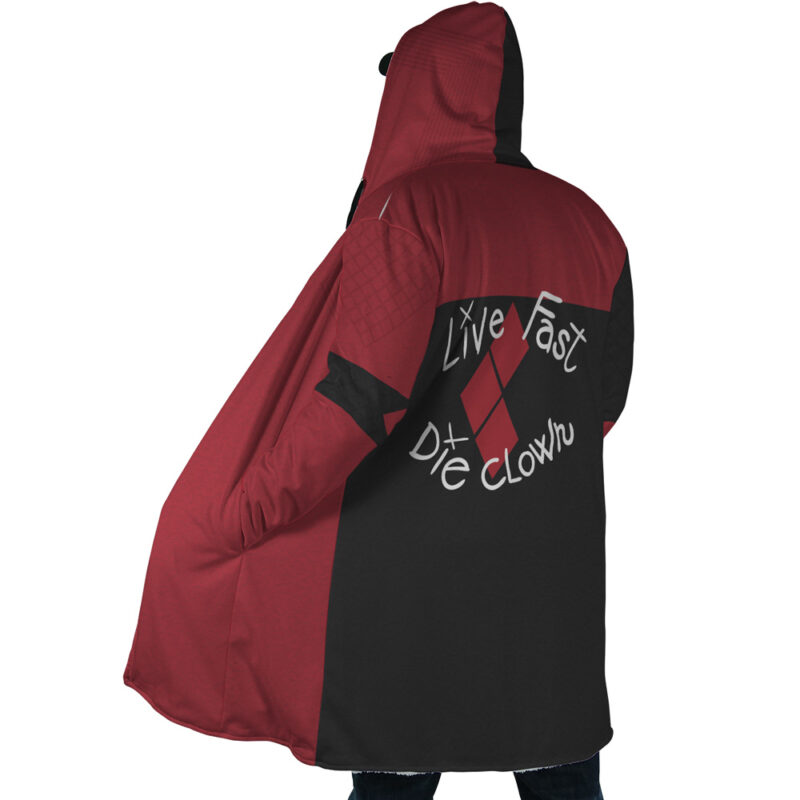 A person is seen from the back wearing the Harley Quinn The Suicide Squad DC Dream Cloak Coat—a red and black hooded jacket with a diamond pattern and "Live Fast Die Clown" in stylized white letters.