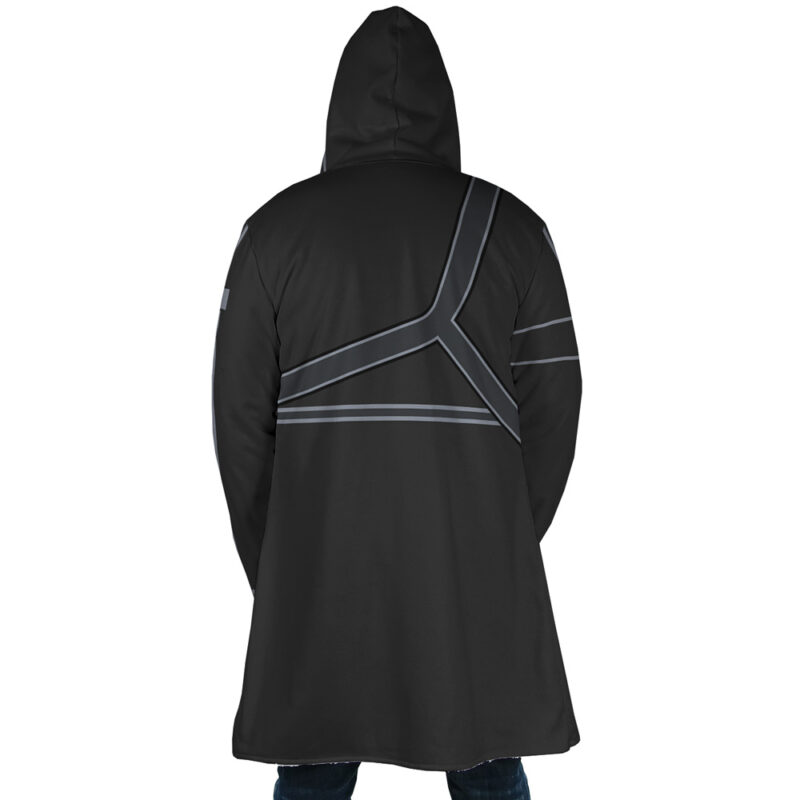 A person stands with their back to the camera, wearing the Kirito Sword Art Online Dream Cloak Coat—a long black hooded coat featuring gray geometric lines on the back.
