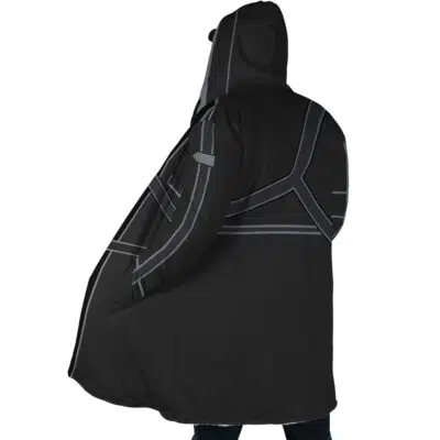 A person wearing the Kirito Sword Art Online Dream Cloak Coat, an oversized black hooded coat with gray geometric lines and a futuristic design, is seen from the back with only their legs partially visible.