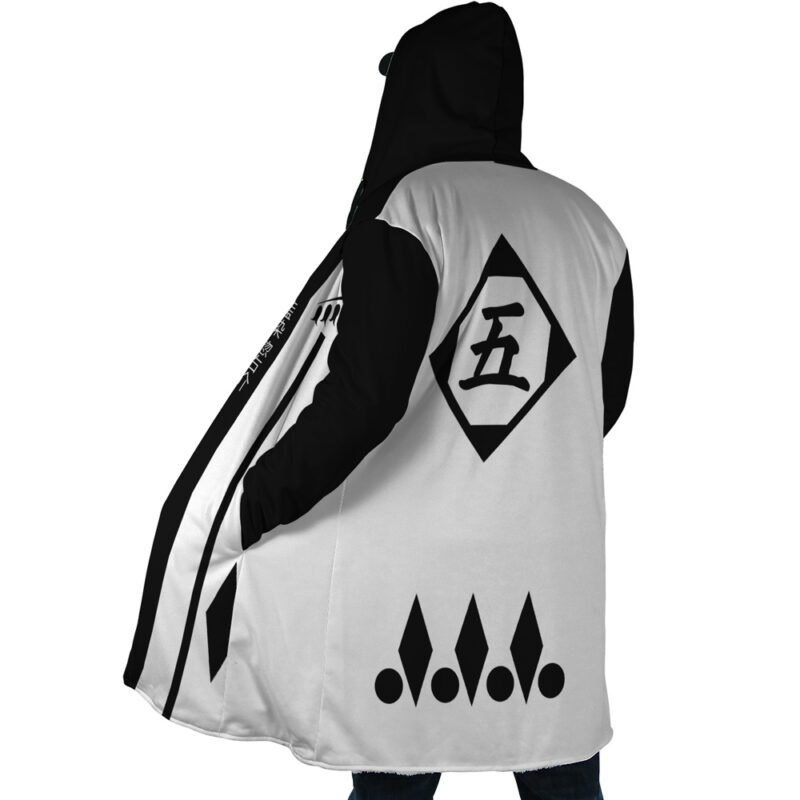 A person wearing the Gotei 13 5th Division Captain Sosuke Aizen Bleach Dream Cloak Coat, a long hooded coat featuring bold black and white geometric patterns, diamond shapes with dots, and Japanese kanji inside a diamond on the upper back.