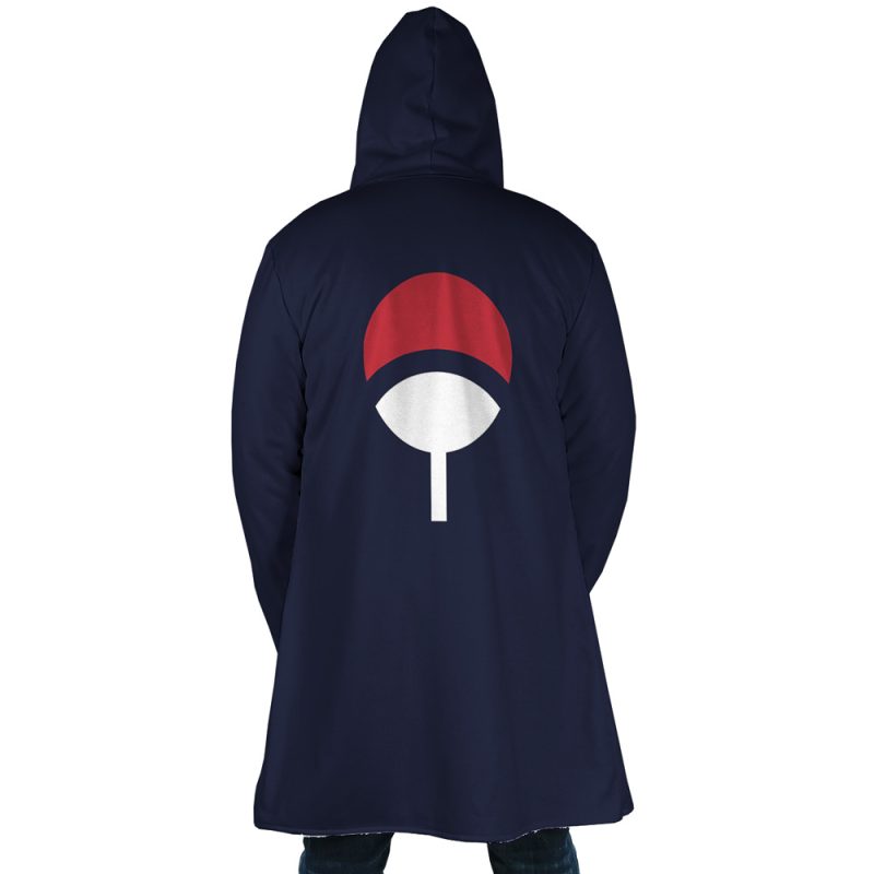 A person wearing the Uchiha Clan Sharingan Shippuden Dream Cloak Coat, featuring a dark blue hood and a red and white fan symbol on the back, stands with their back to the camera.