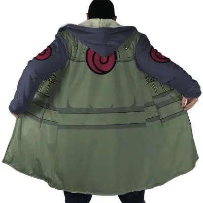 A person stands with their back to the camera, holding open a Kakashi Hatake Shippuden Dream Cloak Coat that features a green, gray, and purple design with red circular symbols and decorative lines.