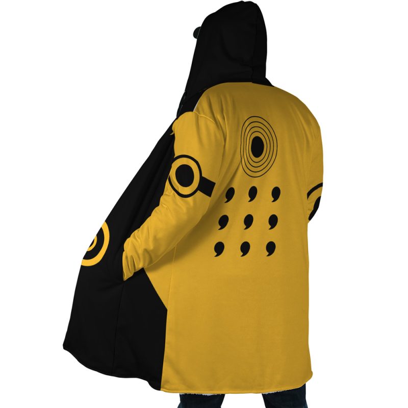 A person wearing the Six Paths Sage Mode Shippuden Dream Cloak Coat, featuring black and yellow panels with dotted black designs and a large circular motif on the sleeve, stands facing away from the camera.