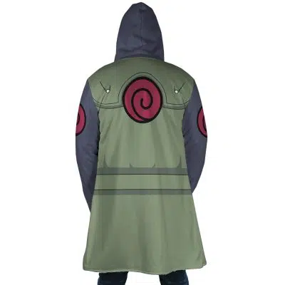A person is seen from behind wearing the Kakashi Hatake Shippuden Dream Cloak Coat, a hooded anime-style green and gray coat with red spiral emblems on the back and sleeves.