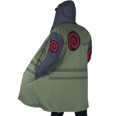A person wearing the Kakashi Hatake Shippuden Dream Cloak Coat, a hooded poncho featuring green and gray colors, red swirl emblems on the sleeves, large pockets, and shown from the back.