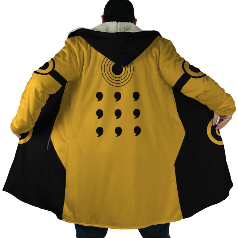 A person facing away wears the Six Paths Sage Mode Shippuden Dream Cloak Coat, a long yellow and black coat with circular sleeve patterns, nine comma marks in three rows on the back, a black hood, and fur collar.