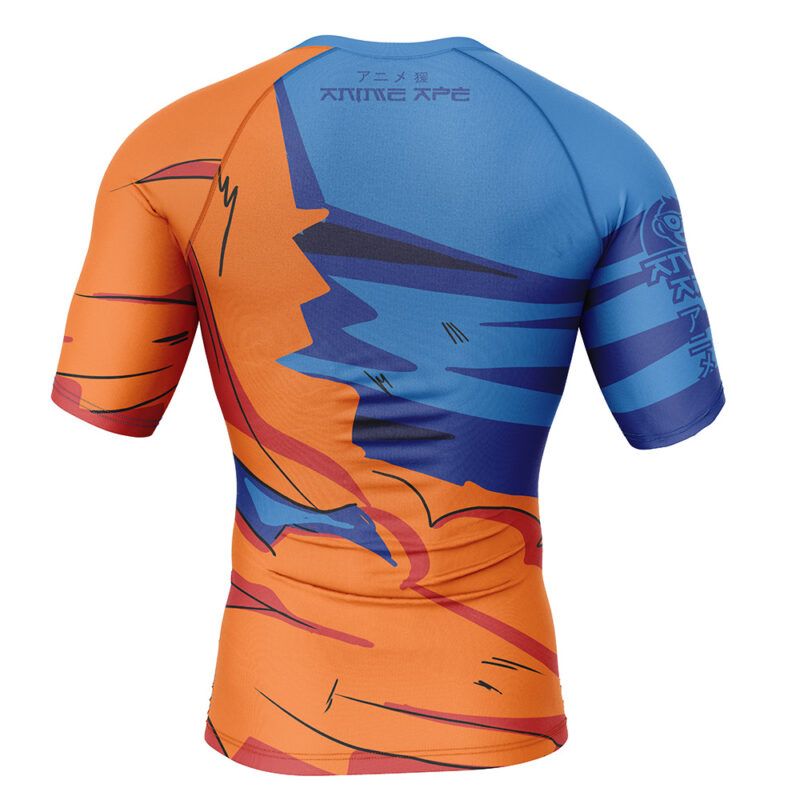 The Goku Torn Gi Dragon Ball Z Short Sleeve Rash Guard Compression Shirt features a vibrant abstract design in orange, blue, and red, with stylized graphics and Japanese text on the back and left sleeve. Displayed from the back.
