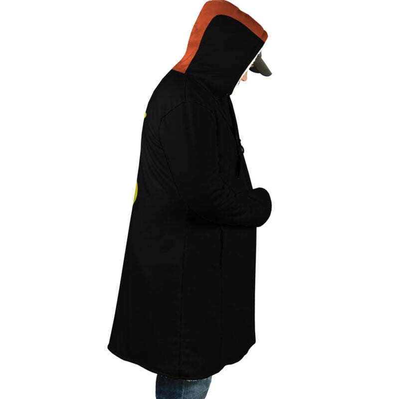 Someone stands in profile against a white background, wearing the Law Timeskip Dressrosa One Piece Corazon Dream Cloak Coat—long and black with an orange hood lining, hands in pockets and head slightly bowed.