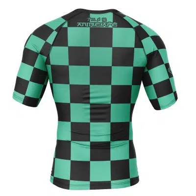 The Tanjiro Kamado Demon Slayer Short Sleeve Rash Guard Compression Shirt features a fitted design, black and green checkered pattern, Japanese-style text at the top, and is shown from the back.
