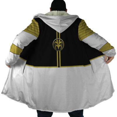 A person seen from behind wears the White Ranger Mighty Morphin Power Rangers Dream Cloak Coat, featuring black and gold accents, a circular gold emblem on the back, and holds the cloak open to the sides.