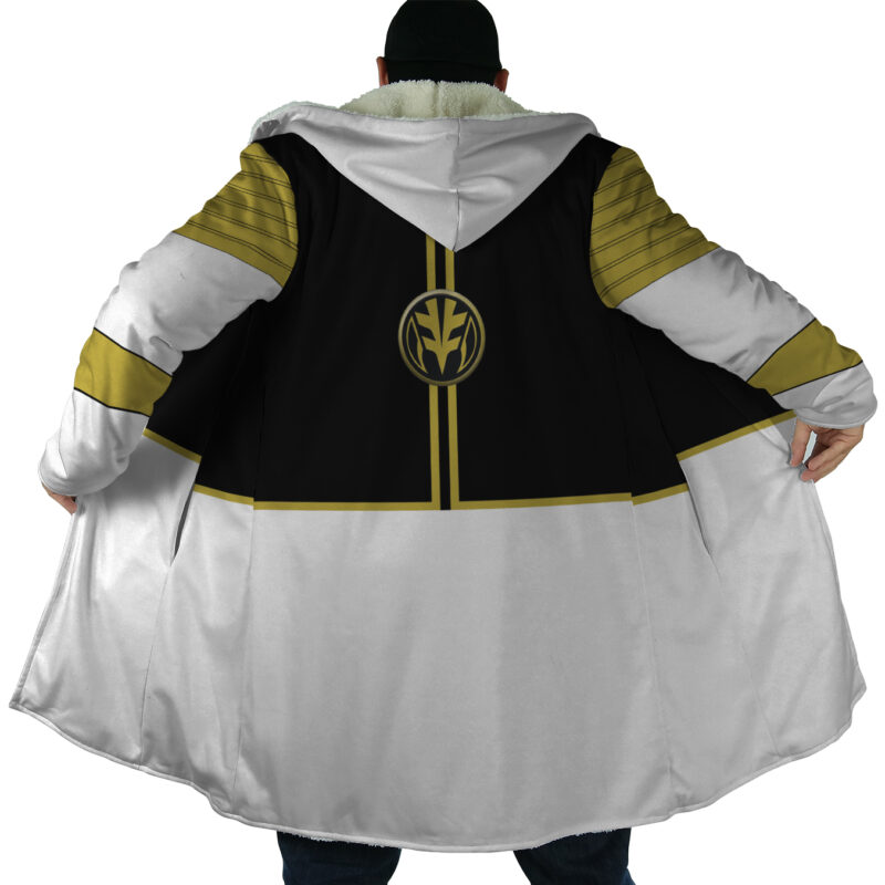 A person seen from behind wears the White Ranger Mighty Morphin Power Rangers Dream Cloak Coat, featuring black and gold accents, a circular gold emblem on the back, and holds the cloak open to the sides.
