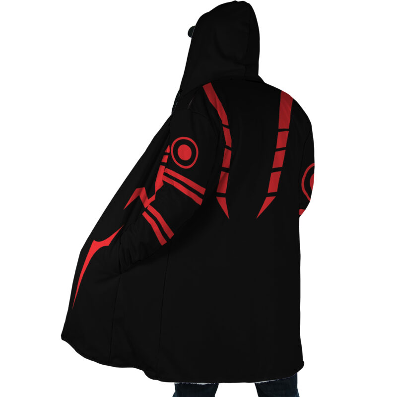 A person is seen from behind wearing the Sukuna Jujutsu Kaisen Dream Cloak Coat, a long black hooded coat with bold red geometric patterns. Only their lower legs and feet are visible in the image.