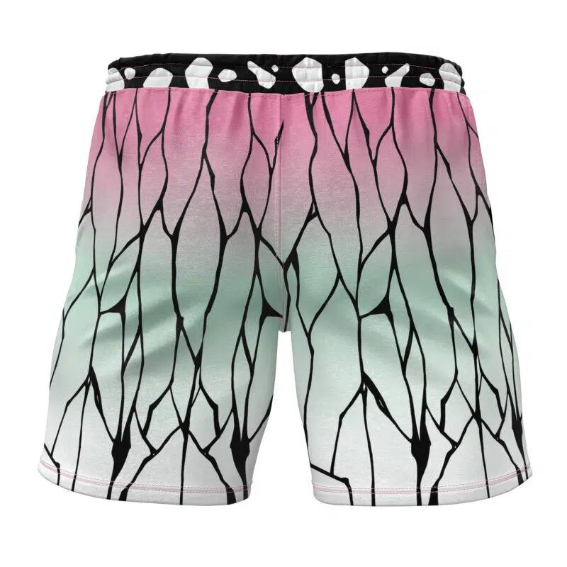 The Shinobu Kocho V2 Demon Slayer Gym Shorts feature a gradient design that transitions from pink at the top to light green and white at the bottom, completed with a bold black branching pattern throughout.