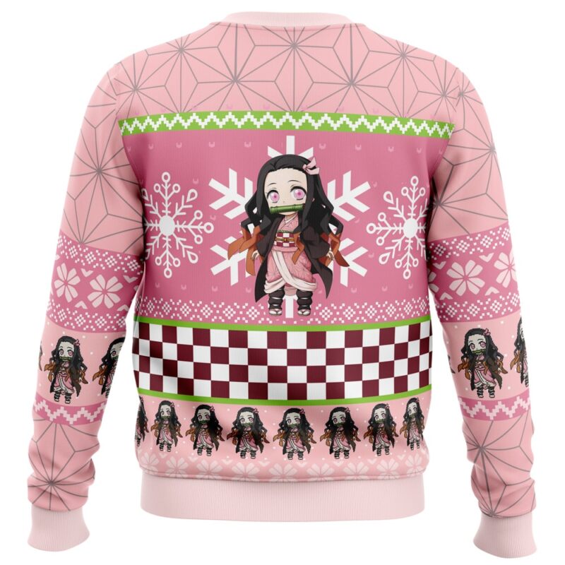 The Chibi Christmas Nezuko Kamado Demon Slayer Ugly Christmas Sweater is pink with anime-style characters, snowflakes, green accents, geometric patterns, checkerboard designs on the back, and a central character surrounded by white snowflakes.