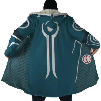 A person facing away wears the Jace Beleren Magic The Gathering Dream Cloak Coat—a teal hooded coat with silver futuristic designs, open to show striped lining and a small red and white circular emblem inside the right side.