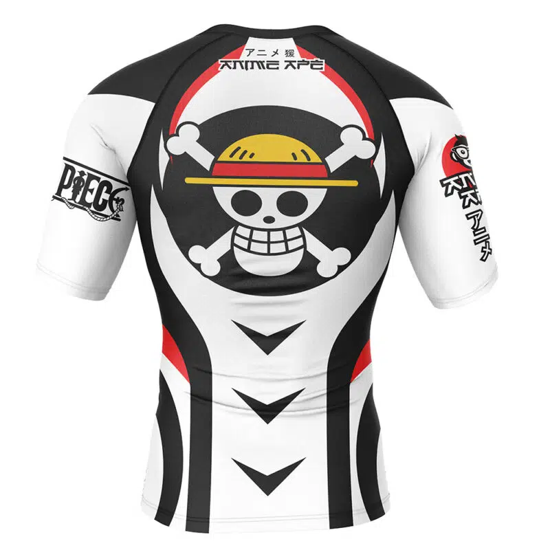 The Straw Hat One Piece Short Sleeve Rash Guard Compression Shirt features the Straw Hat Pirates skull logo with a straw hat on the back, black and white patterns, plus Japanese text on the upper back and right sleeve.