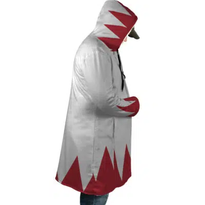 A person wearing the White Mage Final Fantasy Dream Cloak Coat, featuring a long hooded design with a jagged red and white geometric pattern, is shown from the side with the hood up and hands in their pockets.