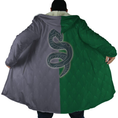 Someone seen from behind wears the Hogwarts Legacy Slytherin Harry Potter Dream Cloak Coat, a long split-color (gray left, green right) design with a large snake emblem on the back and the coat spread open.